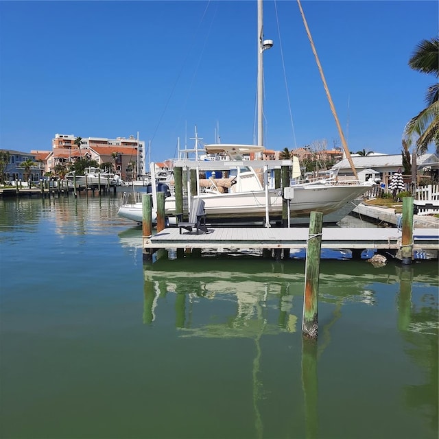 319 Boca Ciega Dr, Madeira Beach, FL 33708 - dock featuring a water view and boat lift
