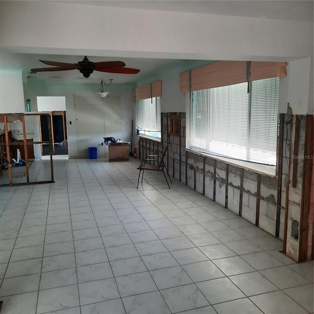 319 Boca Ciega Dr, Madeira Beach, FL 33708 - living area featuring ceiling fan and tile patterned flooring