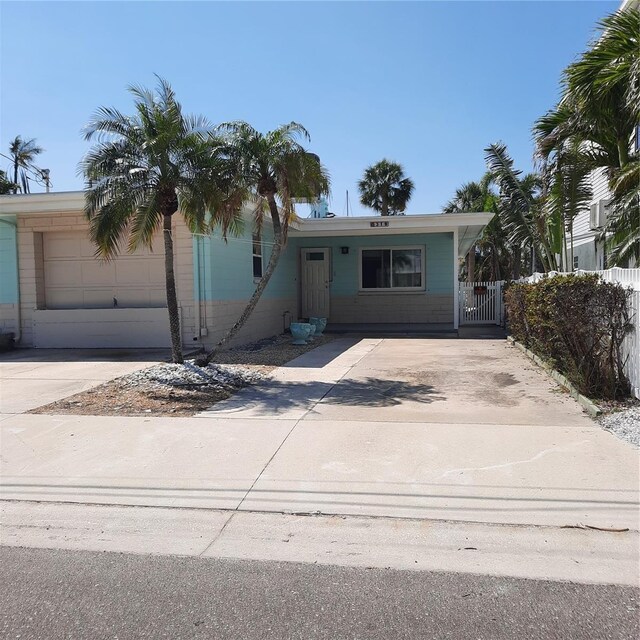 319 Boca Ciega Dr, Madeira Beach, FL 33708 - view of front of house featuring concrete driveway