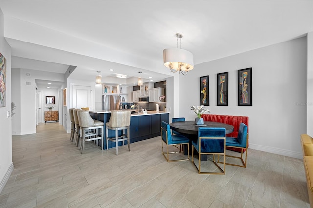 1325 Snell Isle Blvd NE Unit 810, Saint Petersburg, FL 33704 - dining space featuring a chandelier, baseboards, light wood-style flooring, and recessed lighting