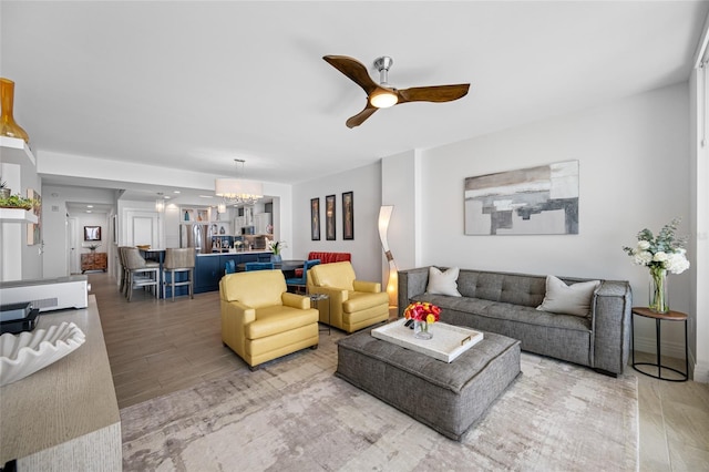 1325 Snell Isle Blvd NE Unit 810, Saint Petersburg, FL 33704 - living room with a ceiling fan, a chandelier, and wood finished floors