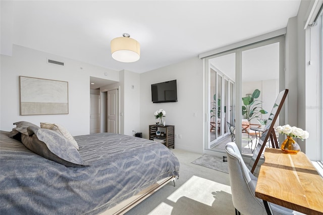 1325 Snell Isle Blvd NE Unit 810, Saint Petersburg, FL 33704 - bedroom featuring access to outside, light carpet, multiple windows, and french doors