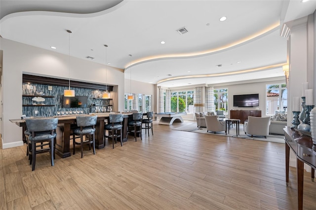 1325 Snell Isle Blvd NE Unit 810, Saint Petersburg, FL 33704 - dining area with plenty of natural light, recessed lighting, light wood-style flooring, and a community bar