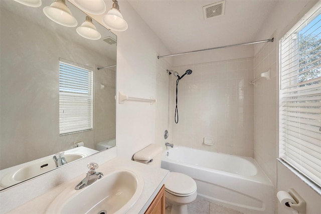 full bath featuring toilet, vanity, shower / washtub combination, and healthy amount of natural light