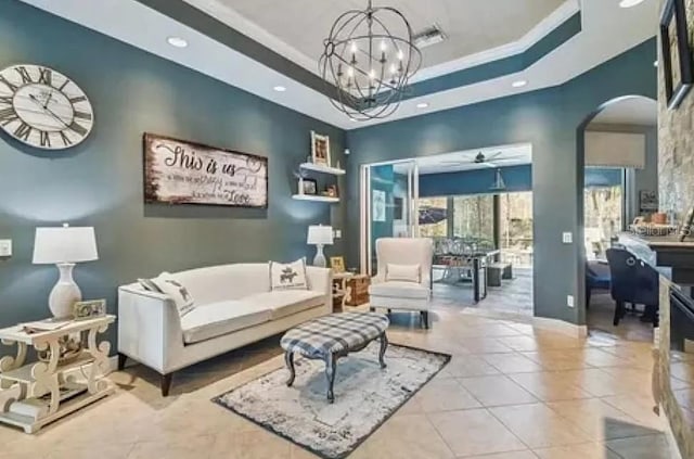 21513 Belvedere Ln, Estero, FL 33928 - tiled living area with recessed lighting, arched walkways, a raised ceiling, a chandelier, and ceiling fan