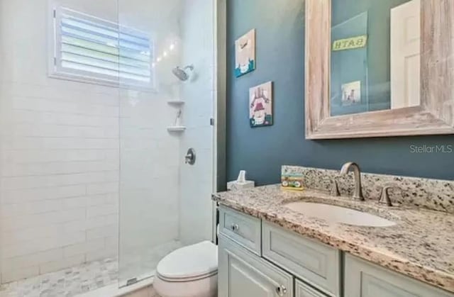 21513 Belvedere Ln, Estero, FL 33928 - full bath featuring toilet, tiled shower, and vanity