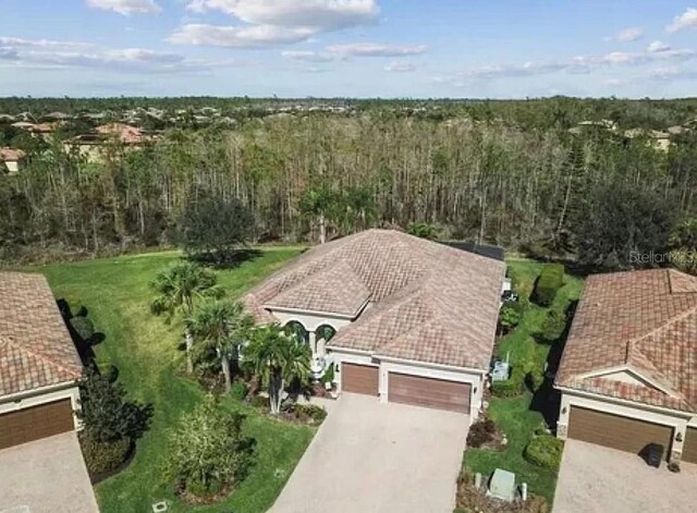 21513 Belvedere Ln, Estero, FL 33928 - view of subject property with a heavily wooded area