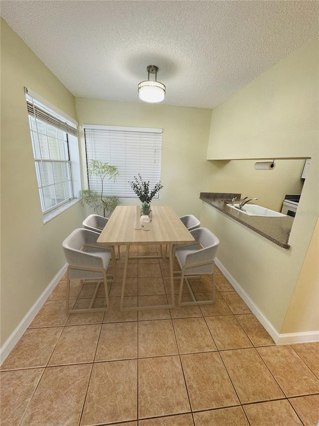 6931 Stones Throw Cir N Unit 5210, Saint Petersburg, FL 33710 - dining area with a textured ceiling and light tile patterned floors