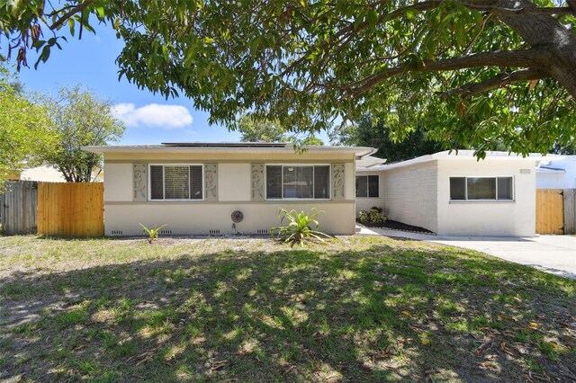 5010 8th Ave N, Saint Petersburg, FL 33710 - ranch-style house with solar panels and stucco siding
