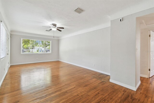 5010 8th Ave N, Saint Petersburg, FL 33710 - unfurnished room featuring ceiling fan, wood finished floors, and baseboards