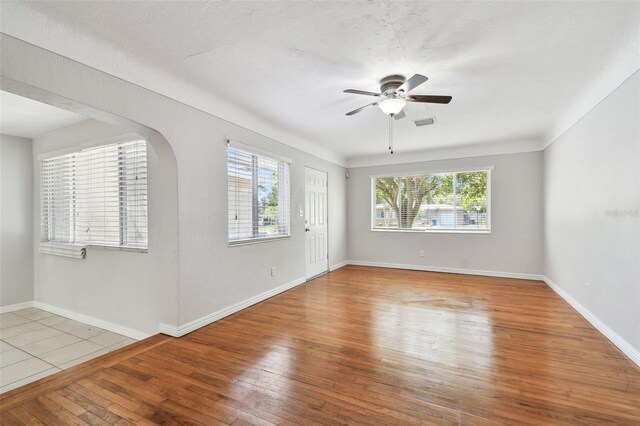 5010 8th Ave N, Saint Petersburg, FL 33710 - empty room featuring hardwood / wood-style flooring, ceiling fan, and baseboards