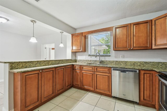 5010 8th Ave N, Saint Petersburg, FL 33710 - kitchen featuring stainless steel appliances, a sink, stone counters, and pendant lighting