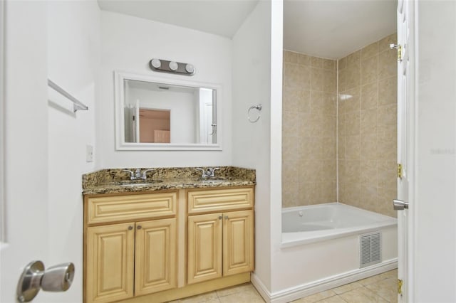 5010 8th Ave N, Saint Petersburg, FL 33710 - bathroom featuring tile patterned floors, vanity, and shower / washtub combination