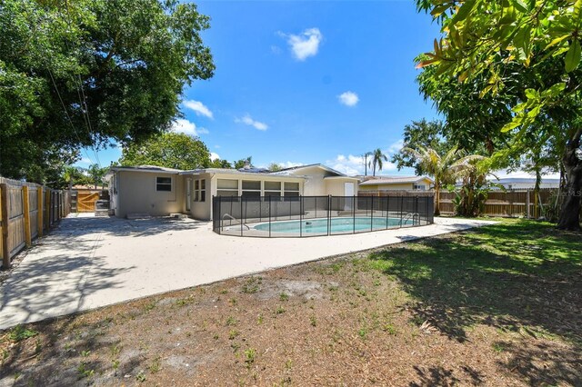 5010 8th Ave N, Saint Petersburg, FL 33710 - view of swimming pool featuring a patio area, a fenced backyard, and a sunroom