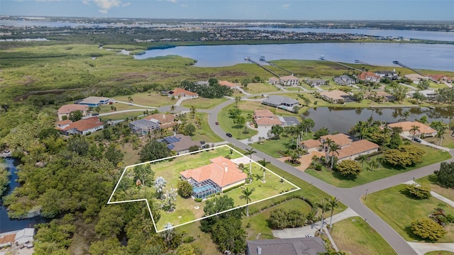 6120 9th Avenue Cir NE, Bradenton, FL 34212 - aerial view of property's location with a large body of water, property boundaries highlighted, and nearby suburban area