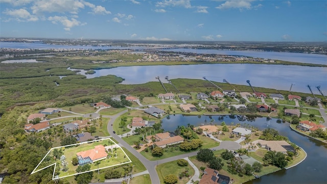 6120 9th Avenue Cir NE, Bradenton, FL 34212 - aerial view of property's location featuring a nearby body of water, property boundaries highlighted, and nearby suburban area