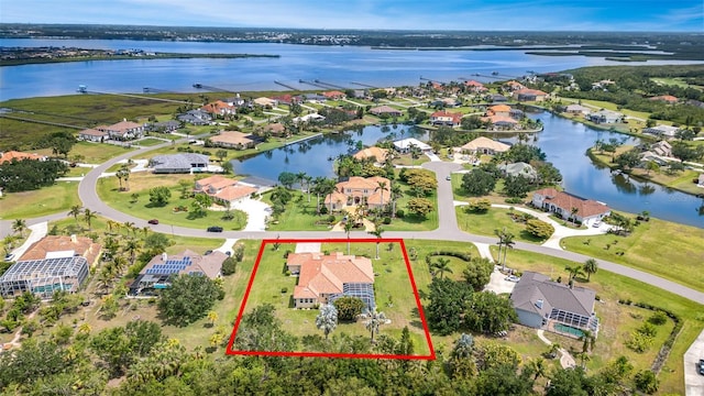6120 9th Avenue Cir NE, Bradenton, FL 34212 - aerial overview of property's location with property parcel outlined, a nearby body of water, and nearby suburban area