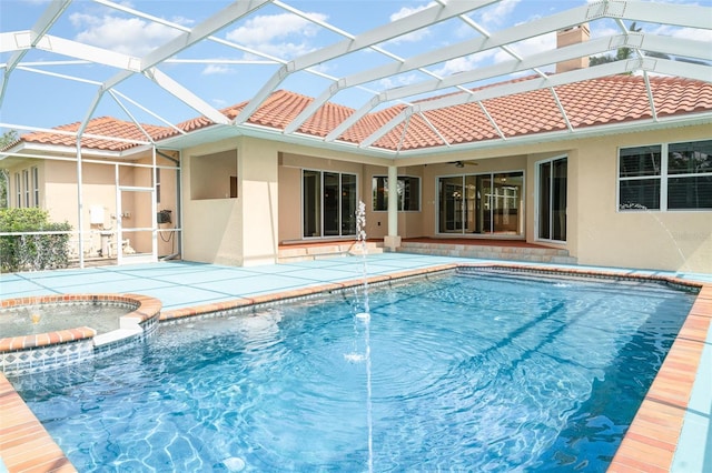 6120 9th Avenue Cir NE, Bradenton, FL 34212 - view of pool with a ceiling fan, a pool with connected hot tub, a patio area, and glass enclosure