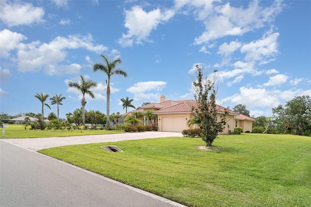 6120 9th Avenue Cir NE, Bradenton, FL 34212 - view of front facade featuring driveway, stucco siding, a chimney, an attached garage, and a tile roof
