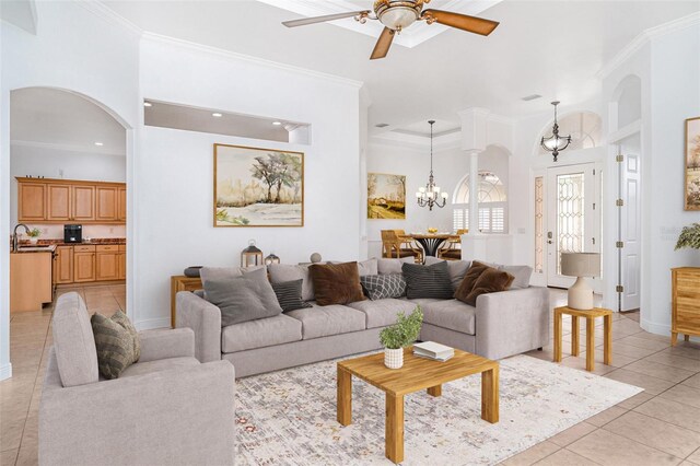 6120 9th Avenue Cir NE, Bradenton, FL 34212 - living area featuring a chandelier, arched walkways, ornamental molding, light tile patterned floors, and ceiling fan