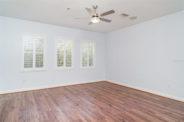 6120 9th Avenue Cir NE, Bradenton, FL 34212 - spare room featuring wood finished floors, a ceiling fan, and baseboards