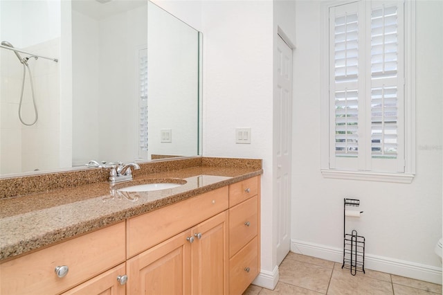 6120 9th Avenue Cir NE, Bradenton, FL 34212 - full bathroom with vanity, tile patterned floors, toilet, a tile shower, and baseboards