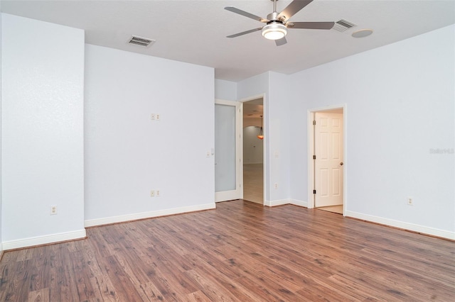 6120 9th Avenue Cir NE, Bradenton, FL 34212 - unfurnished bedroom with wood finished floors, baseboards, and ceiling fan