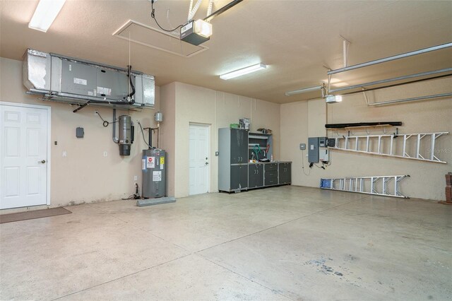 6120 9th Avenue Cir NE, Bradenton, FL 34212 - garage featuring electric water heater, a central vacuum unit, and a garage door opener