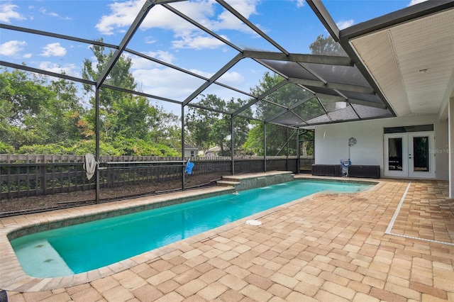21215 Preservation Dr, Land O Lakes, FL 34639 - view of pool with french doors, a patio, a fenced backyard, and a lanai