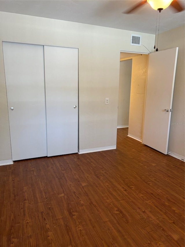 4152 56th Way N Unit 513, Kenneth City, FL 33709 - unfurnished bedroom with wood finished floors, a closet, and ceiling fan