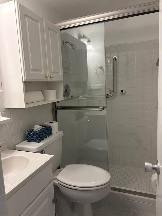 4152 56th Way N Unit 513, Kenneth City, FL 33709 - full bath featuring a shower stall, vanity, and tile walls