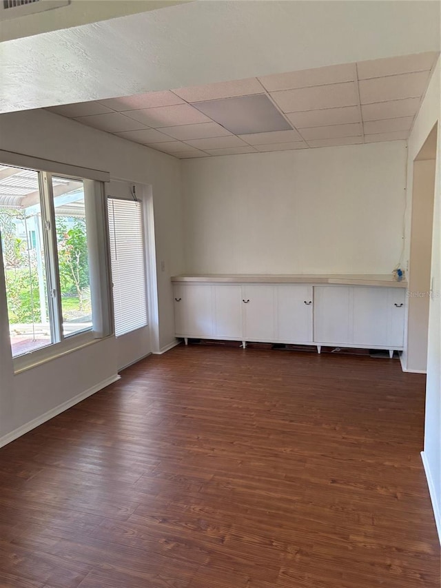 4152 56th Way N Unit 513, Kenneth City, FL 33709 - empty room with dark wood-style flooring and a paneled ceiling