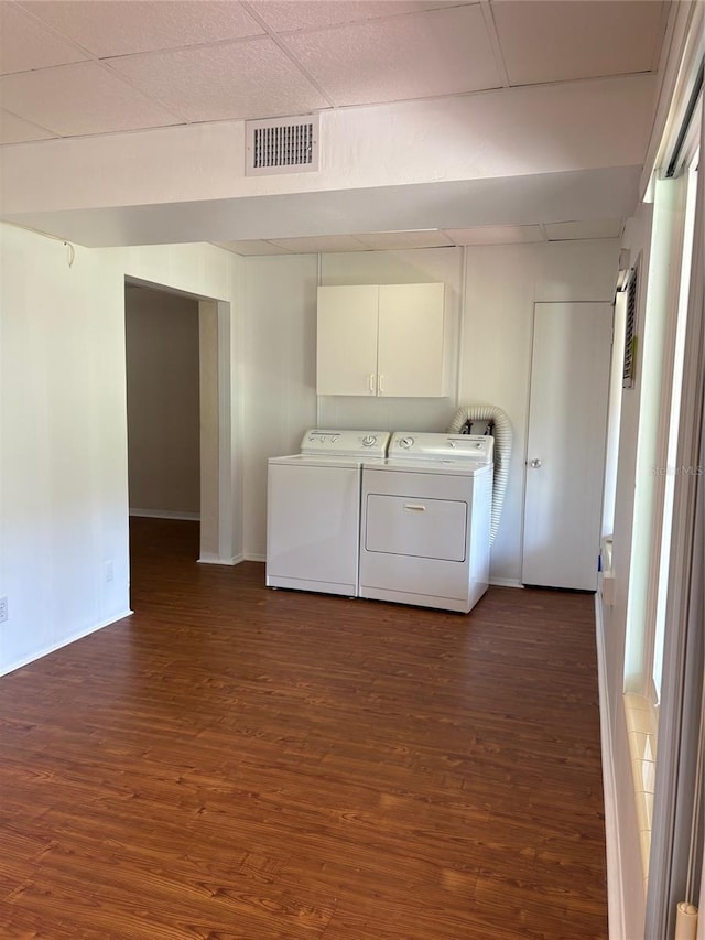 4152 56th Way N Unit 513, Kenneth City, FL 33709 - laundry area with separate washer and dryer, dark wood-style flooring, and cabinet space
