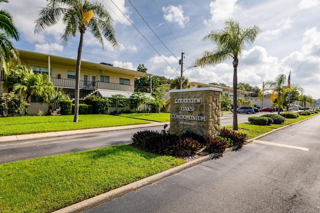 4152 56th Way N Unit 513, Kenneth City, FL 33709 - community / neighborhood sign featuring uncovered parking and a lawn