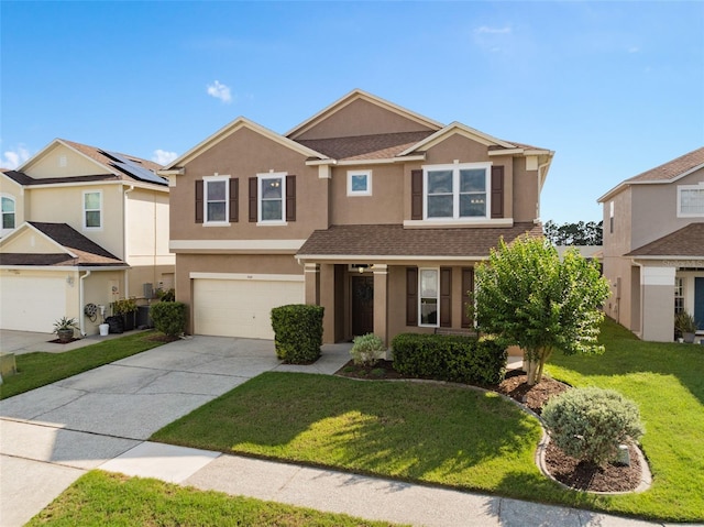 460 Tess Ct, Orlando, FL 32824 - view of front of home with concrete driveway, stucco siding, a front yard, and a garage