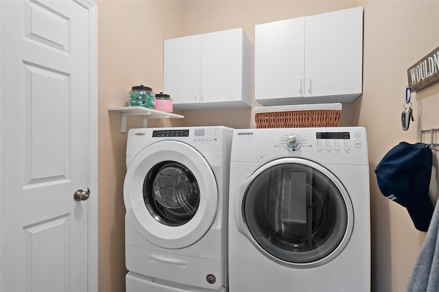 460 Tess Ct, Orlando, FL 32824 - clothes washing area with cabinet space and independent washer and dryer