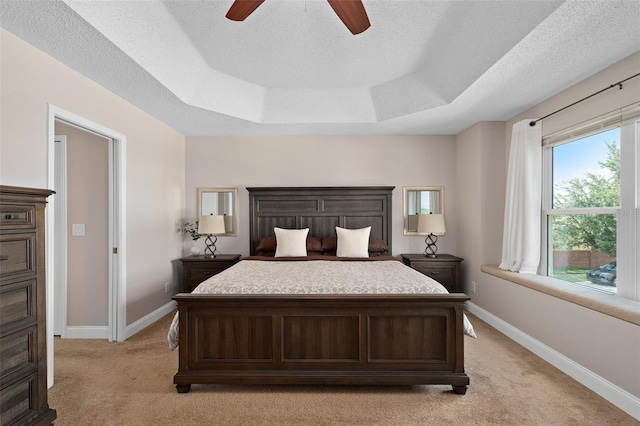 460 Tess Ct, Orlando, FL 32824 - bedroom with light carpet, baseboards, a raised ceiling, and a textured ceiling