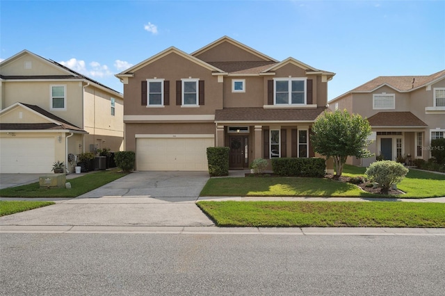 460 Tess Ct, Orlando, FL 32824 - view of front of property with stucco siding, a front lawn, concrete driveway, a garage, and central AC unit