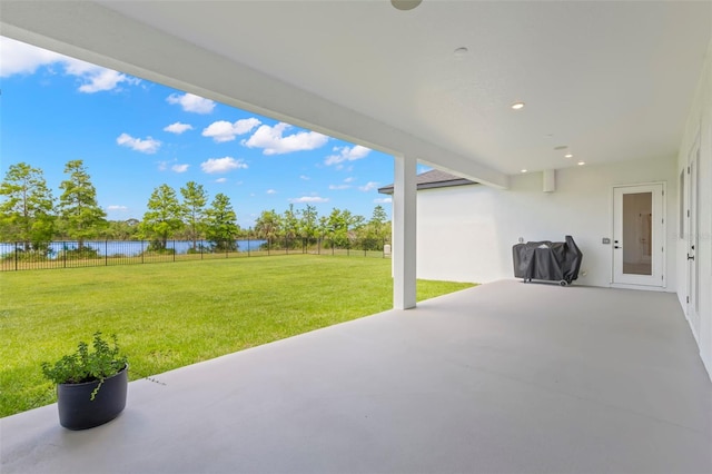 view of patio featuring a water view