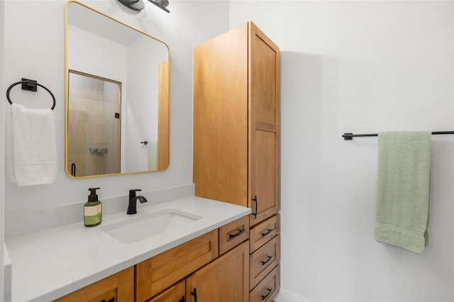 bathroom featuring a shower stall and vanity