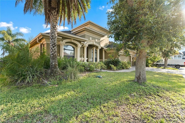 15104 Azra Dr, Odessa, FL 33556 - mediterranean / spanish-style house featuring a garage, a front yard, driveway, and stucco siding