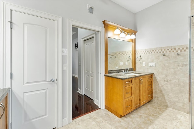 15104 Azra Dr, Odessa, FL 33556 - bathroom featuring vanity, tile walls, tile patterned floors, and a wainscoted wall