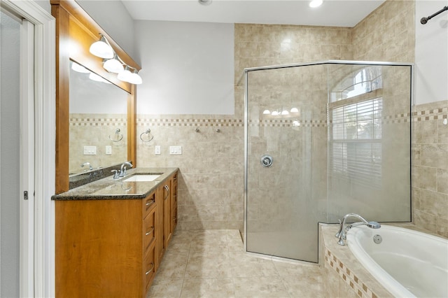 15104 Azra Dr, Odessa, FL 33556 - full bathroom featuring tile walls, a tile shower, a garden tub, tile patterned floors, and vanity