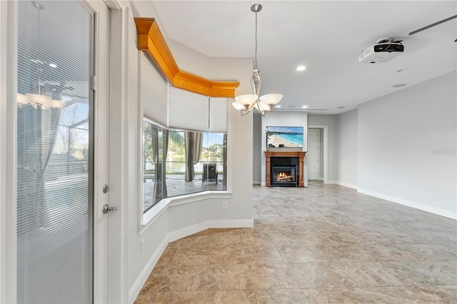 15104 Azra Dr, Odessa, FL 33556 - unfurnished living room with a chandelier, baseboards, a lit fireplace, and recessed lighting