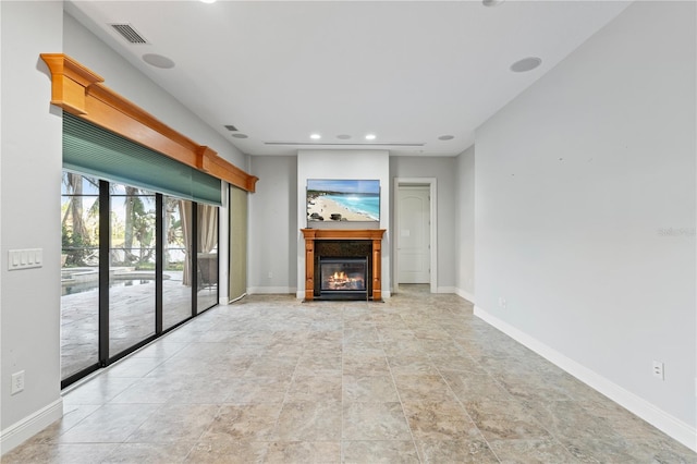 15104 Azra Dr, Odessa, FL 33556 - unfurnished living room with a glass covered fireplace, baseboards, and recessed lighting
