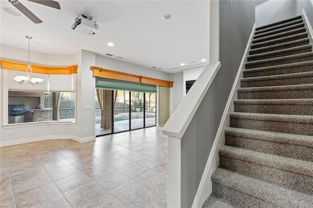 15104 Azra Dr, Odessa, FL 33556 - stairway with ceiling fan, tile patterned floors, baseboards, and recessed lighting