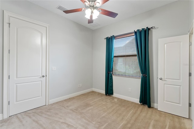 15104 Azra Dr, Odessa, FL 33556 - unfurnished bedroom with light colored carpet, baseboards, and ceiling fan