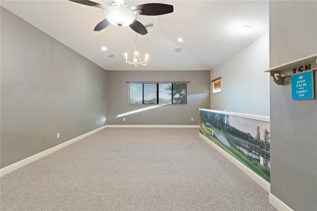 15104 Azra Dr, Odessa, FL 33556 - carpeted spare room with ceiling fan, a chandelier, baseboards, and vaulted ceiling