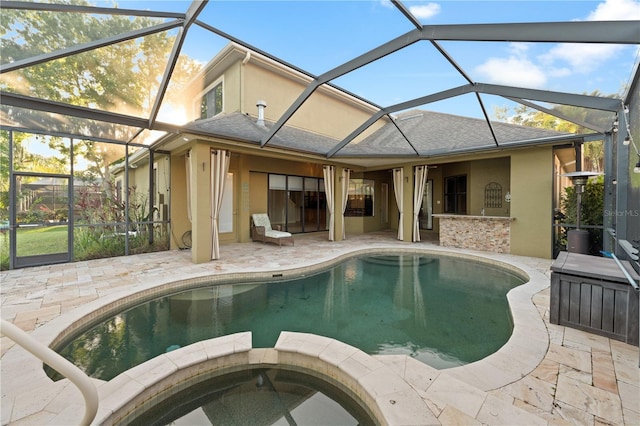 15104 Azra Dr, Odessa, FL 33556 - view of swimming pool with a patio area, glass enclosure, and a pool with connected hot tub