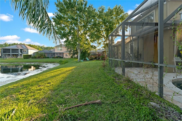 15104 Azra Dr, Odessa, FL 33556 - view of green lawn with a lanai, a residential view, and a water view